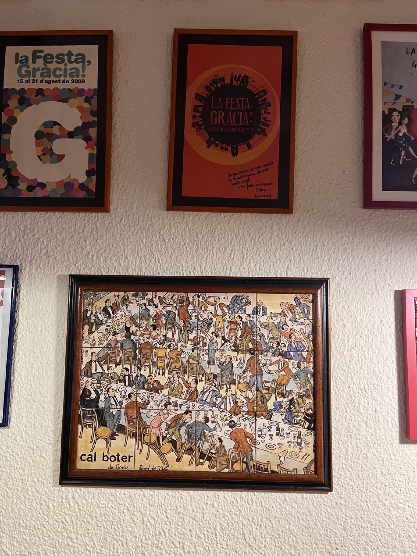 Cal Boter’s walls: festa posters, postcards, and the whole neighbourhood sat down at one table.