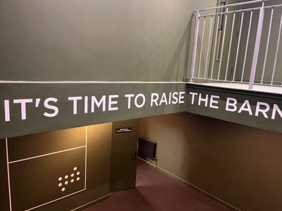 Interior signage reading IT'S TIME TO RAISE THE BARN