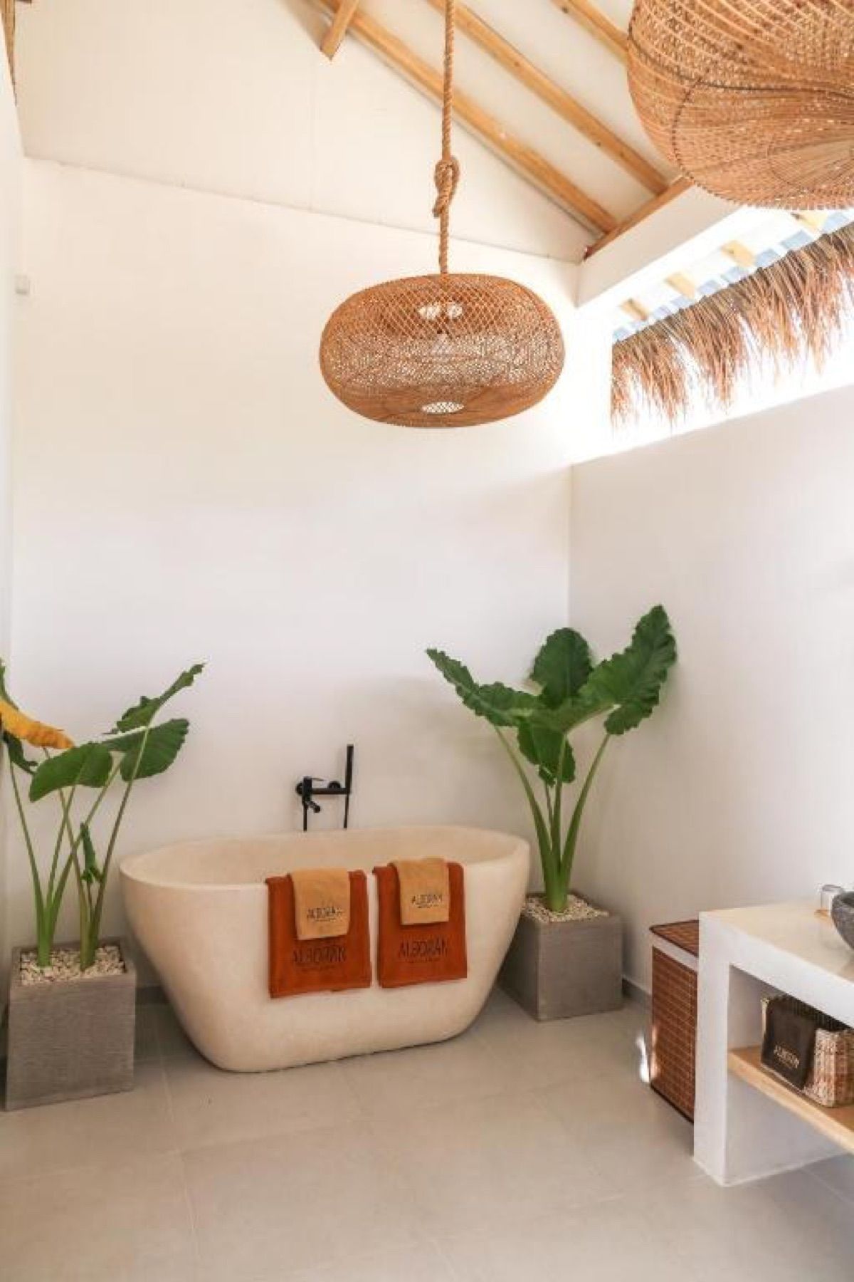 Inside: a stone bath the colour of the walls.