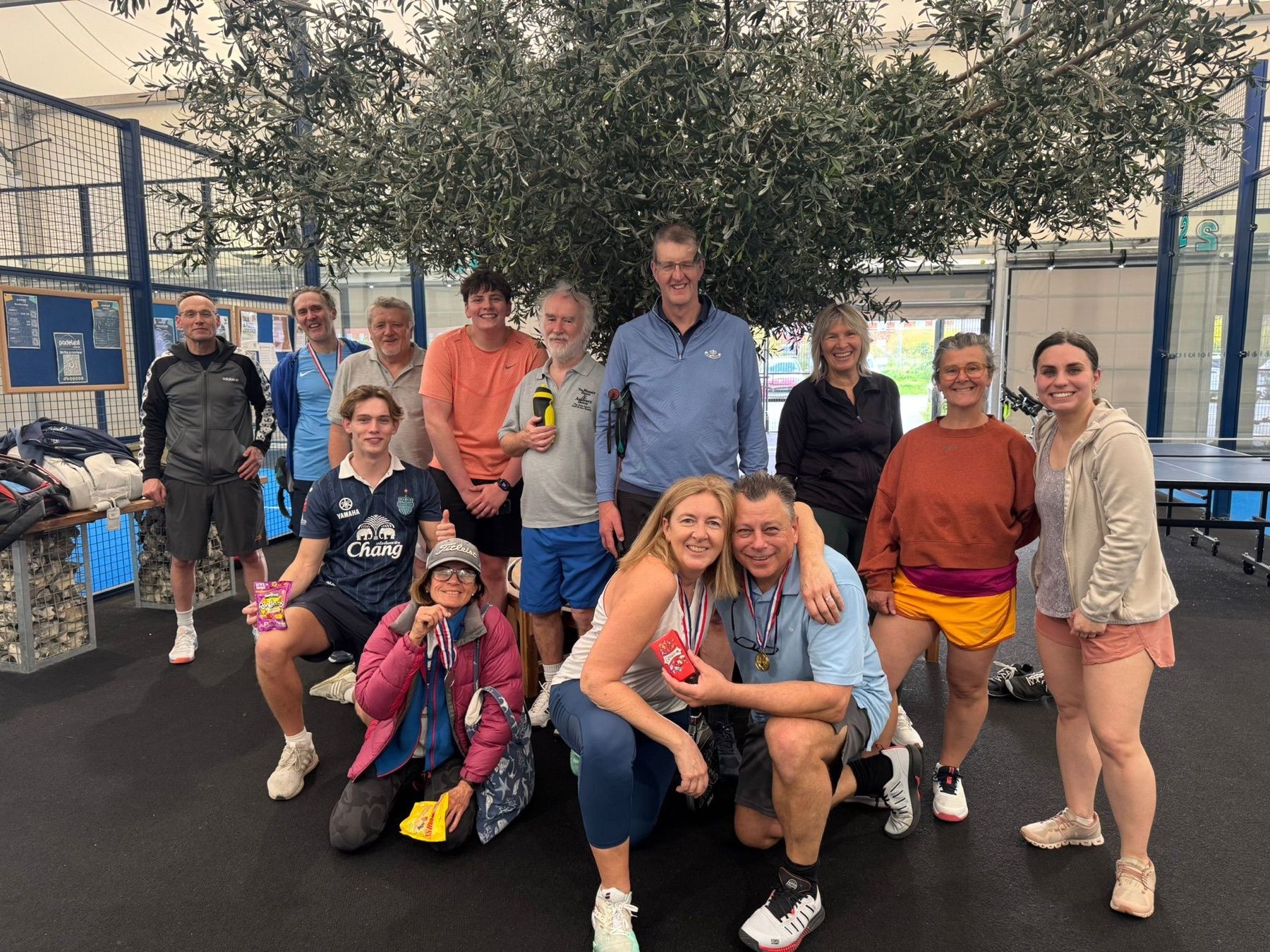 Claudia Paoloni’s Sunday Padelers at Padel4all, Lockleaze: Claudia and John Gahan, centre, with the medals.
